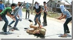 stone pelters in kashmir beating army